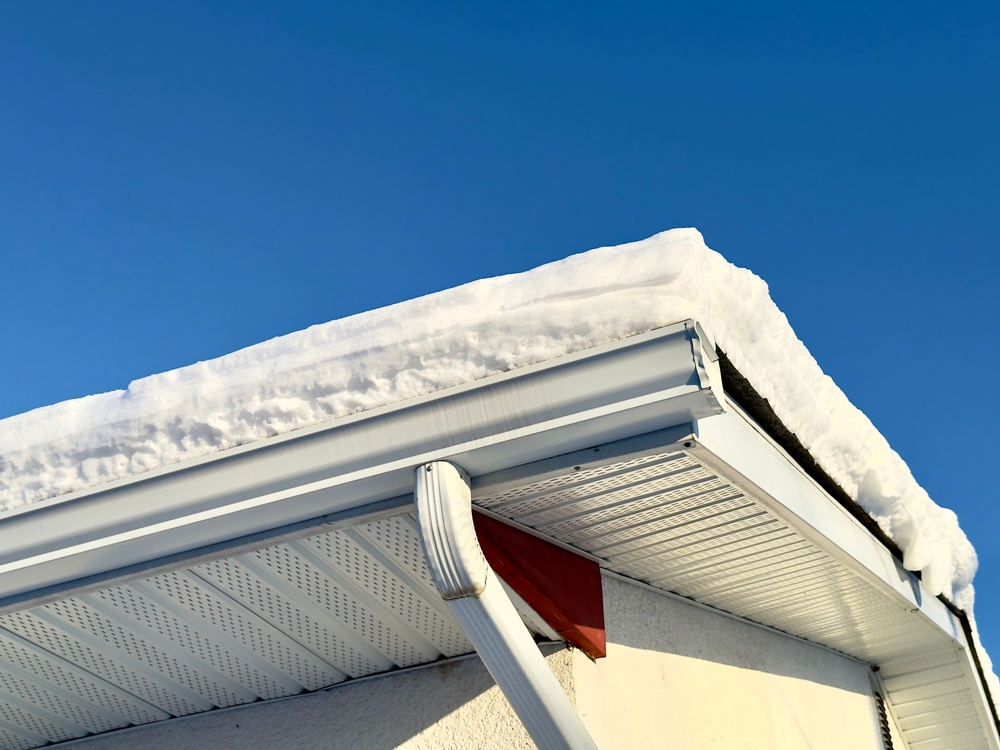 Snow,Covered,Roof,With,White,Gutters