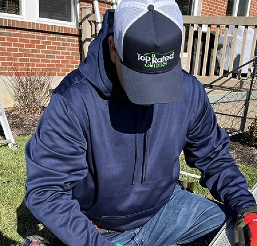 Top Rated Gutters technician on a job
